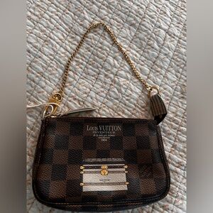 Louis Vuitton Damier Ebene Mini Pochette with Gold Chain and Trunk Print